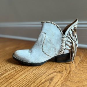 White distressed fringe booties